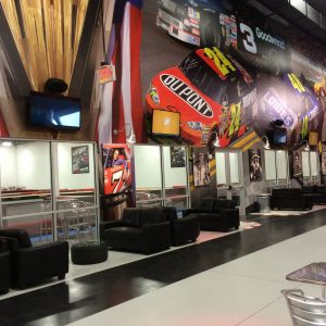 the lobby at k1 speed concord featuring large nascar wall graphic and images of champions