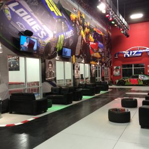 another lobby shot of k1 speed concordwith images of nascar champions on the wall
