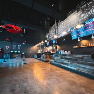 the lobby of k1 speed west palm beach with a ferrari f1 car on wall