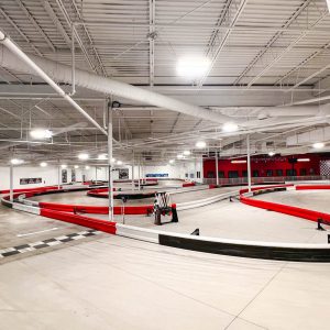 a shot of the start-finish line and corners at the indoor go kart racing track inside k1 speed traverse city