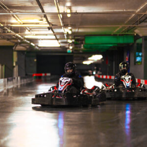 two go karts racing at k1 speed go karting in london