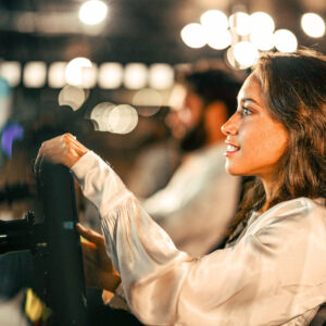 a woman plays a racing simulator at k1 speed in canary wharf, london