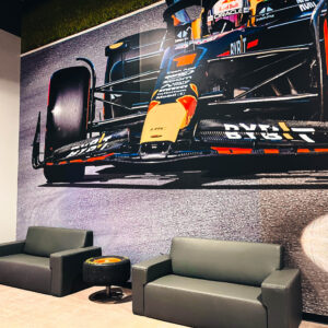 leather couches and a large photo of max verstappen