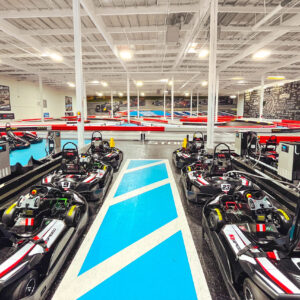 the interior of k1 speed tukwila with go-karts lined up and an indoor track