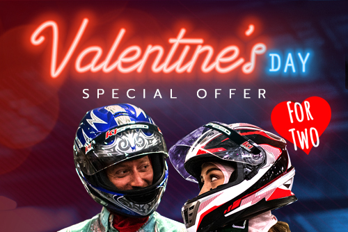 a man and a woman wearing race helmets with text thats reads "valentines day special offer for two"